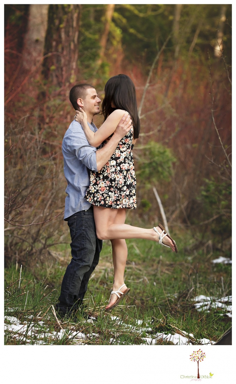 Sonora engagement and wedding photographer Christine Dibble Photography takes engagement photos of a couple in the woods at Pinecrest as they dance on a stump and walk through the trails. 