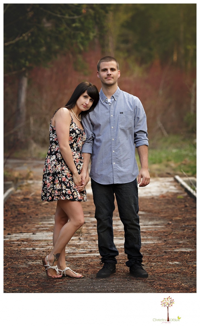 Sonora engagement and wedding photographer Christine Dibble Photography takes engagement photos of a couple in the woods at Pinecrest as they dance on a stump and walk through the trails. 