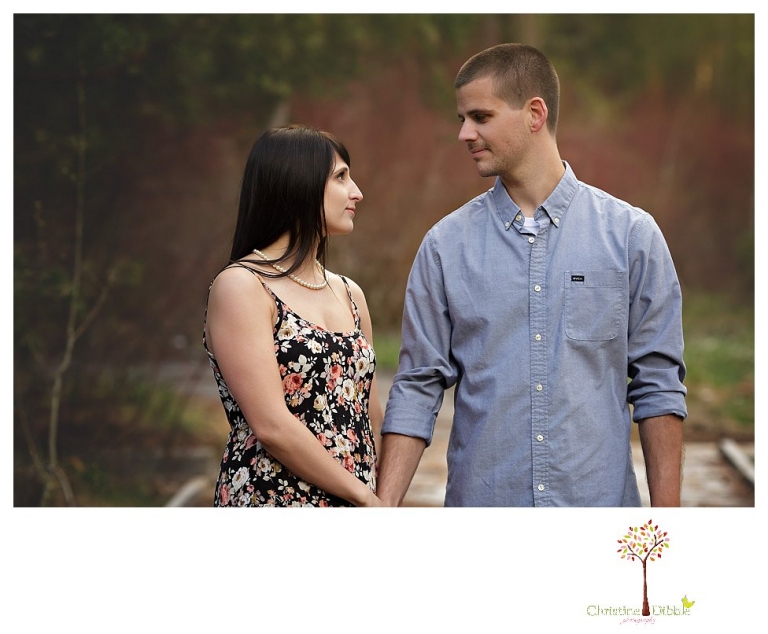 Sonora engagement and wedding photographer Christine Dibble Photography takes engagement photos of a couple in the woods at Pinecrest as they dance on a stump and walk through the trails. 