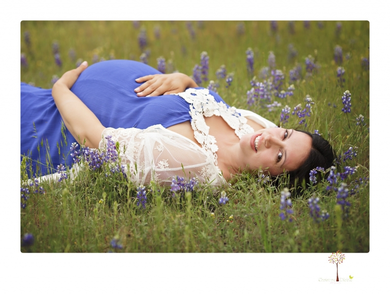 Sonora Maternity Photographer Christine Dibble Photography takes beautiful belly portraits of a mom-to-be pregnant with her fourth child in a blue dress and lace in a field of Lupine in Twain Harte.
