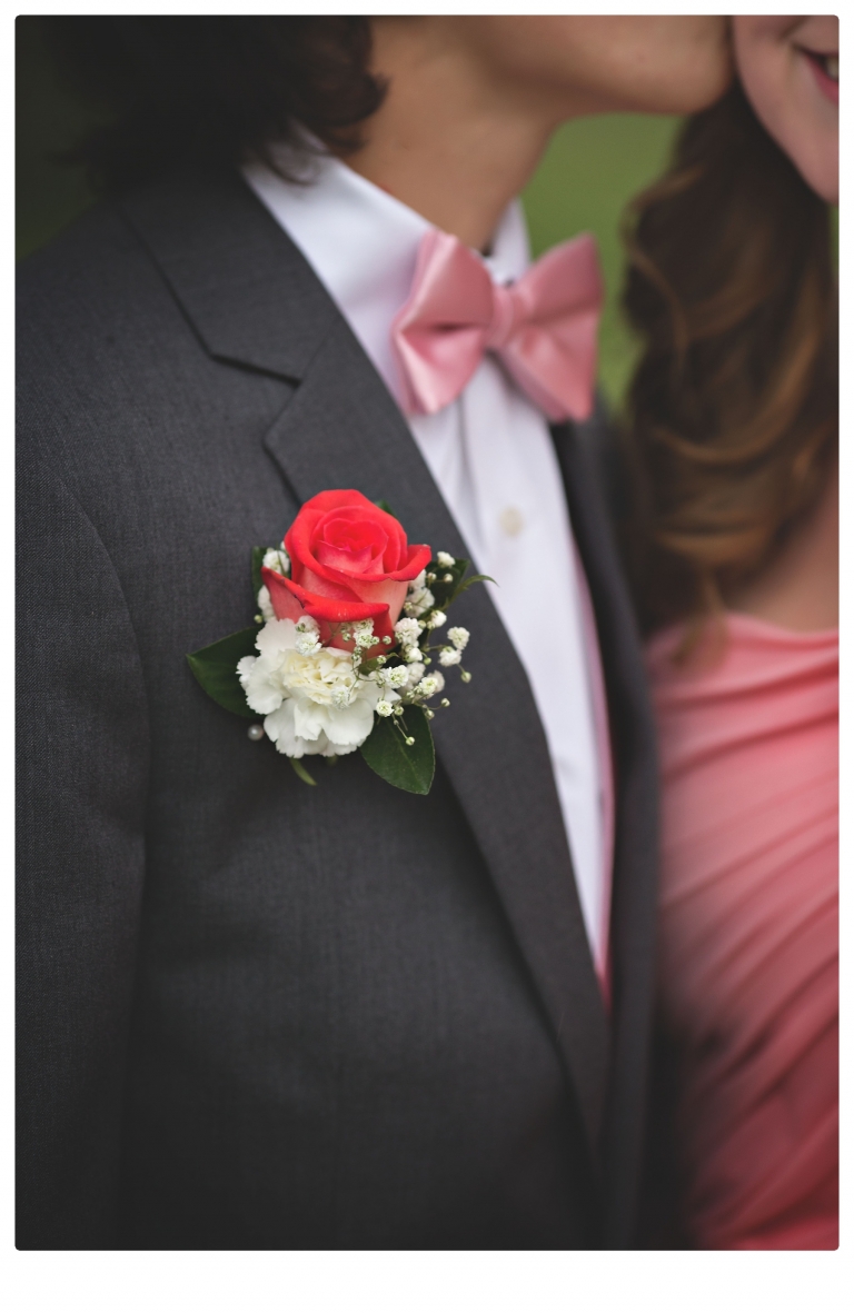 Sonora senior portrait photographer Christine Dibble Photography takes portraits of couples before the Summerville High School prom in a field wet from rain with a blue velvet chair.