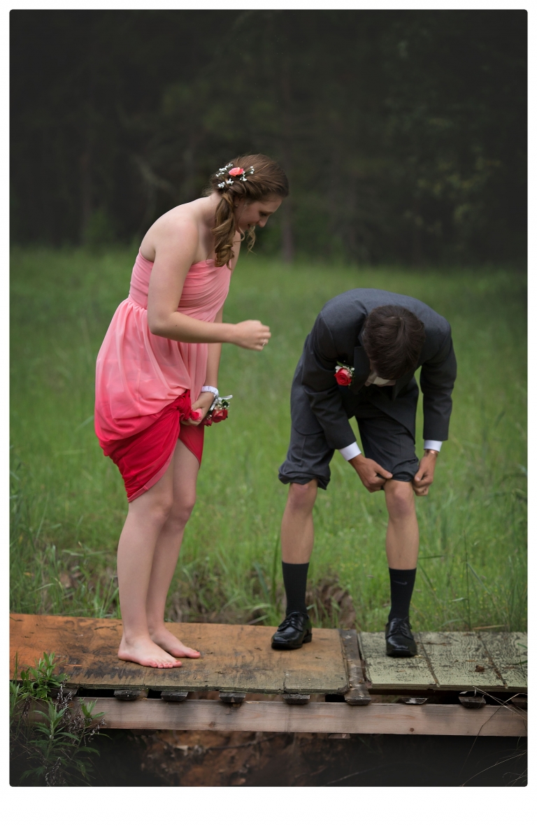 Sonora senior portrait photographer Christine Dibble Photography takes portraits of couples before the Summerville High School prom in a field wet from rain with a blue velvet chair.