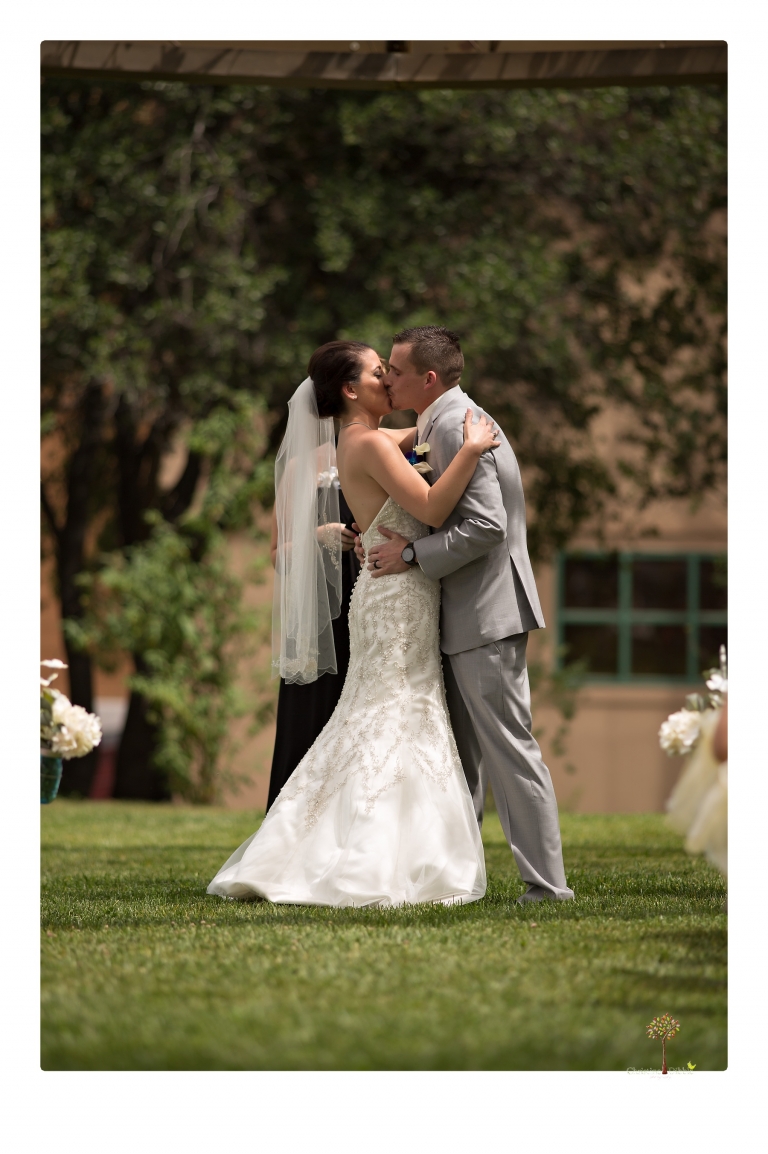 Sonora Wedding Photographer Christine Dibble Photography takes wedding photos at a Black Oak Casino Resort wedding including the first kiss.