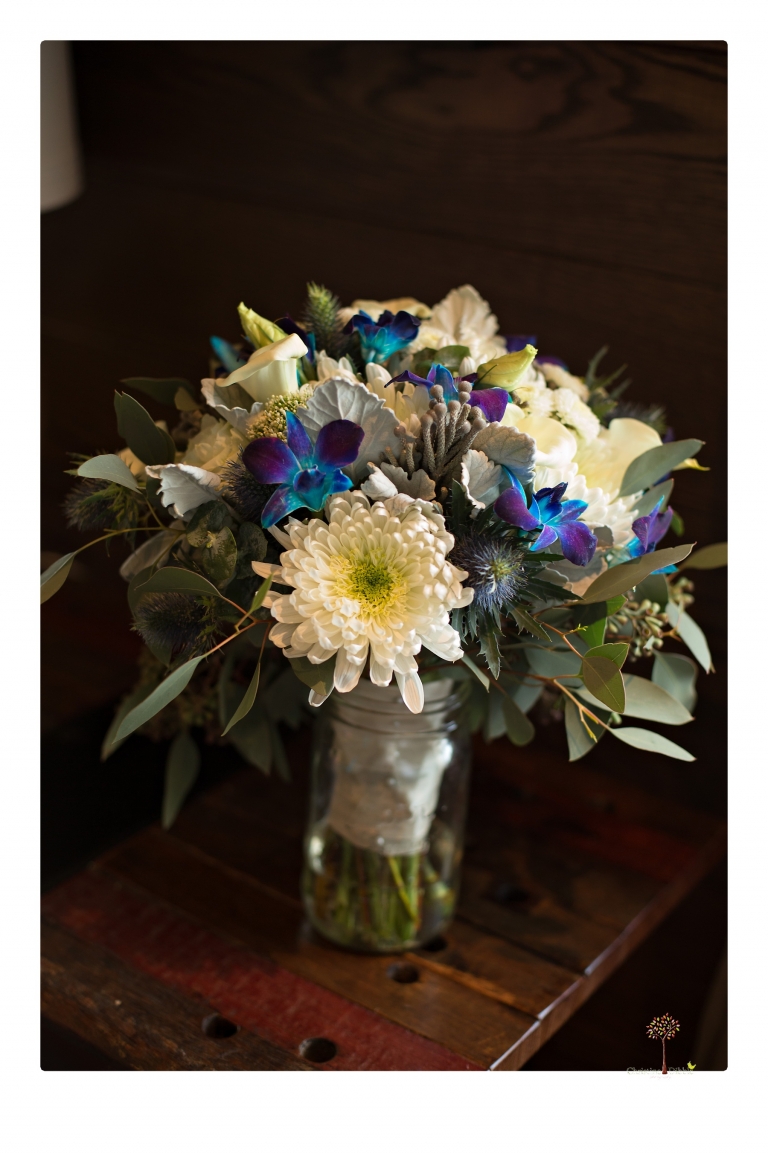 Sonora Wedding Photographer Christine Dibble Photography takes wedding photos at a Black Oak Casino Resort wedding including the blue orchid bouquet from Columbia Nursery.