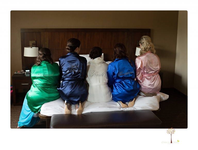 Sonora Wedding Photographer Christine Dibble Photography takes wedding photos at a Black Oak Casino Resort wedding including the bridesmaids in satin jeweled robes.