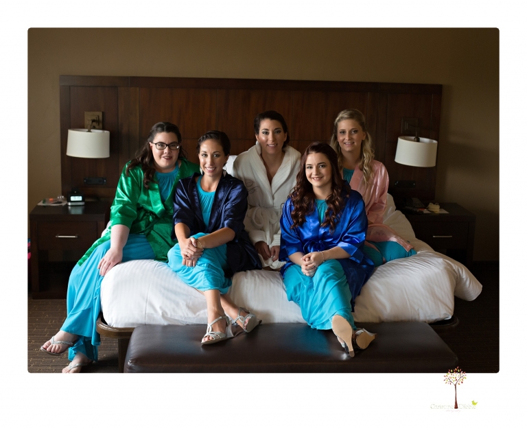 Sonora Wedding Photographer Christine Dibble Photography takes wedding photos at a Black Oak Casino Resort wedding including the bridal party in satin jeweled robes.