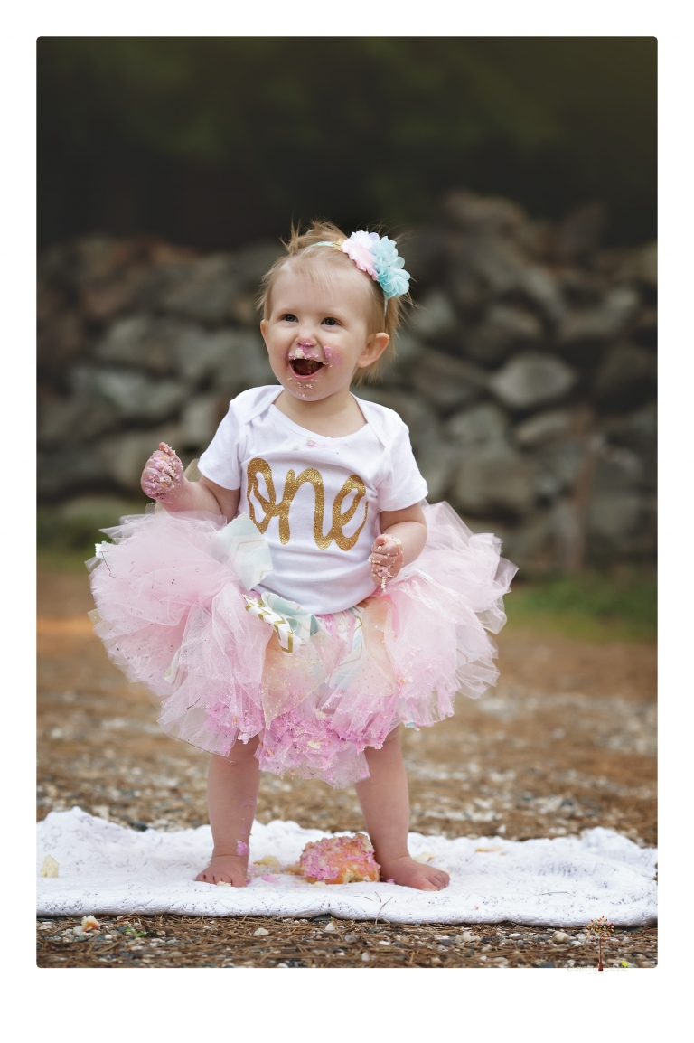 Sonora and Grass Valley family photographer Christine Dibble Photography takes first birthday cake smash photos of a baby girl and her family.  
