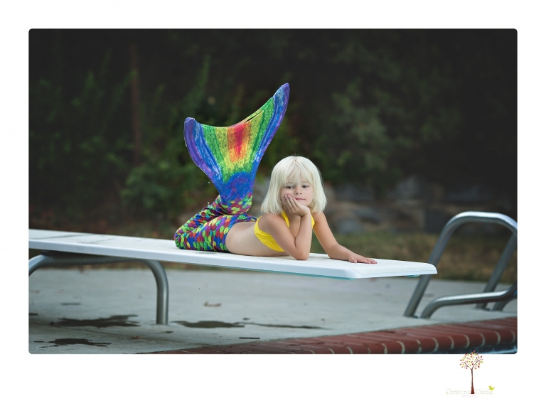 Sonora Child Photographer Christine Dibble Photography takes mermaid birthday photos of a five year old girl in her finfun mermaid tail in her swimming pool.