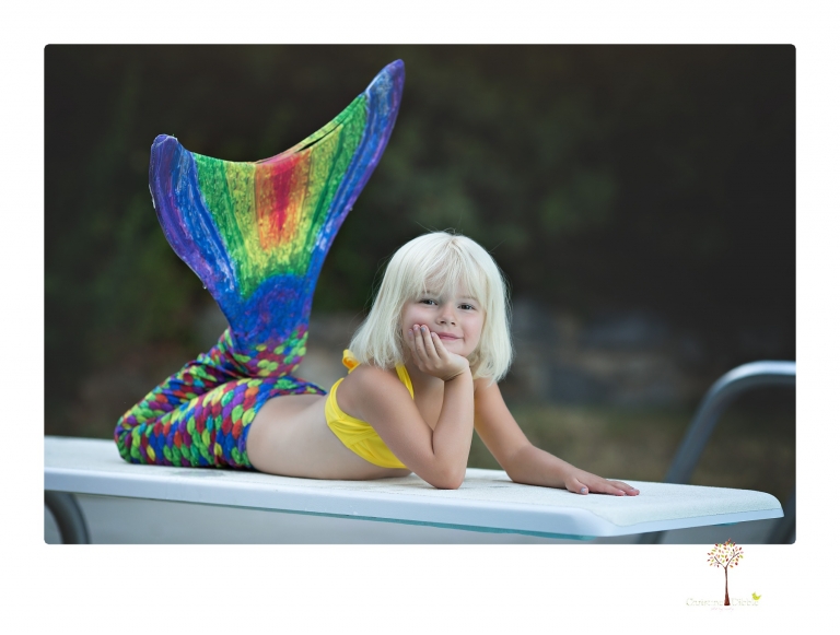 Sonora Child Photographer Christine Dibble Photography takes mermaid birthday photos of a five year old girl in her finfun mermaid tail in her swimming pool.