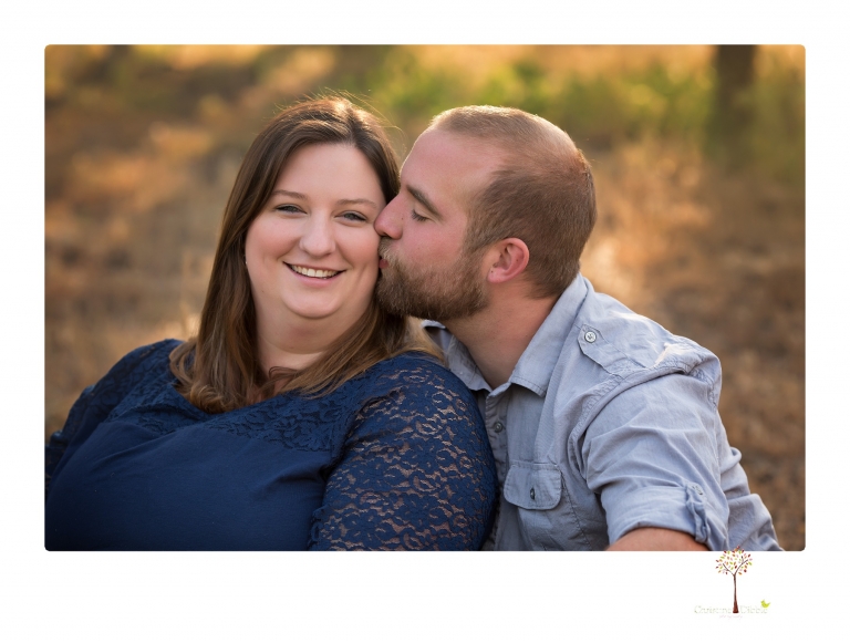 Sonora family photographer Christine Dibble Photography photographs a pregnancy announcement at Hurst Ranch as a wife tells her husband she is pregnant with baby number three during a family portrait session.
