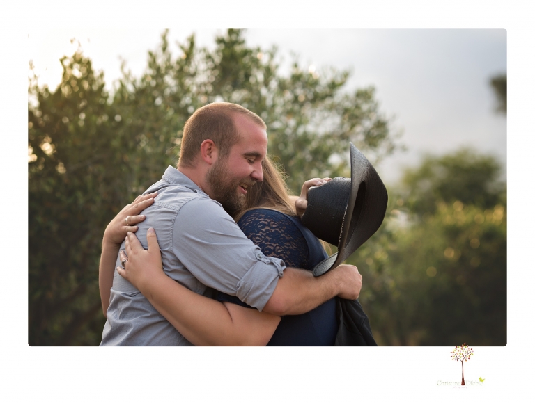 Sonora family photographer Christine Dibble Photography photographs a pregnancy announcement at Hurst Ranch as a wife tells her husband she is pregnant with baby number three during a family portrait session.