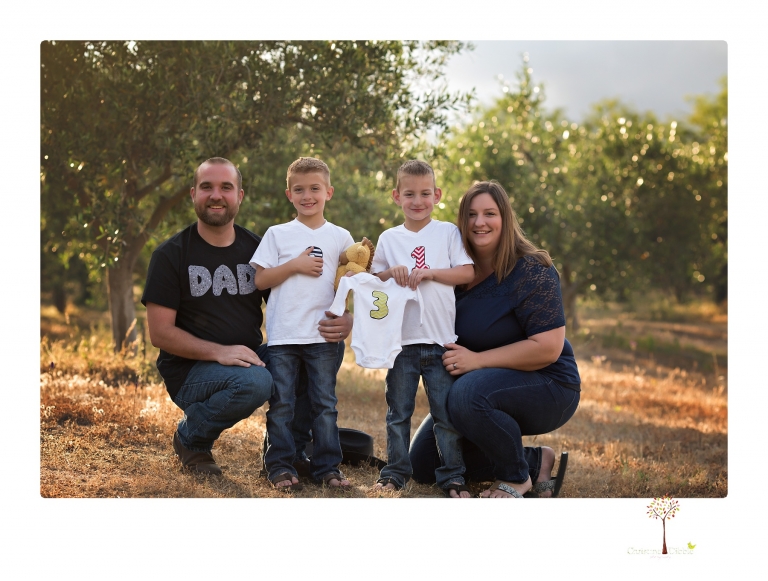 Sonora family photographer Christine Dibble Photography photographs a pregnancy announcement at Hurst Ranch as a wife tells her husband she is pregnant with baby number three during a family portrait session.