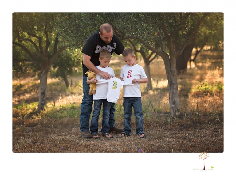 Sonora family photographer Christine Dibble Photography photographs a pregnancy announcement at Hurst Ranch as a wife tells her husband she is pregnant with baby number three during a family portrait session.