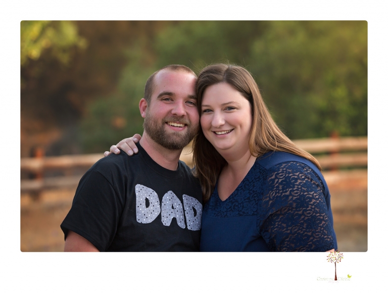 Sonora family photographer Christine Dibble Photography photographs a pregnancy announcement at Hurst Ranch as a wife tells her husband she is pregnant with baby number three during a family portrait session.