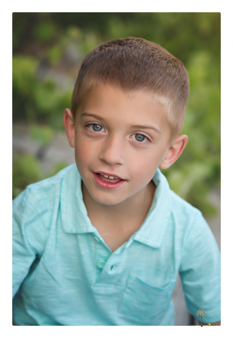 Sonora family photographer Christine Dibble Photography photographs a pregnancy announcement at Hurst Ranch as a wife tells her husband she is pregnant with baby number three during a family portrait session.