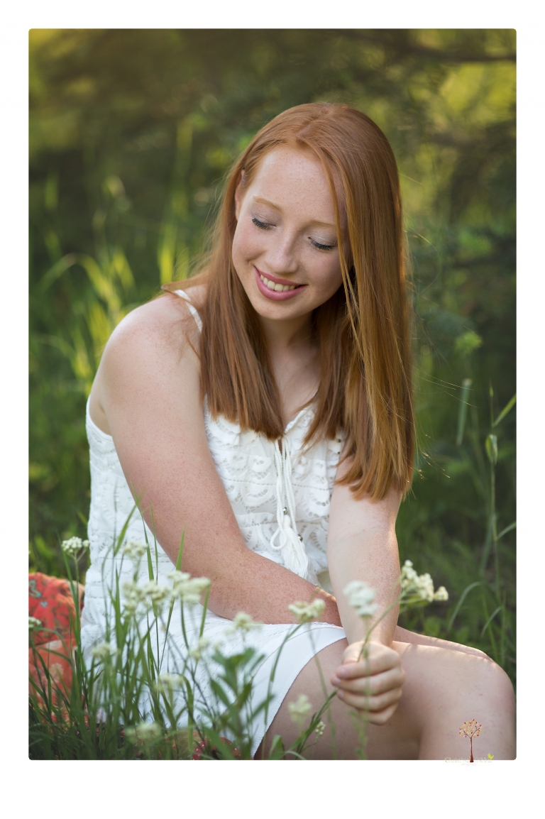 Sonora Graduation Photographer Christine Dibble Photography takes portraits of a red headed eighth grade graduate at her eighth grade graduation portrait session outside of Long Barn in fields of flowers.