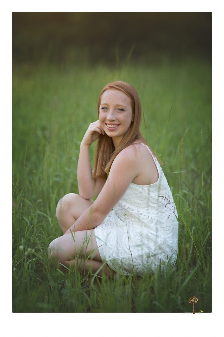 Sonora Graduation Photographer Christine Dibble Photography takes portraits of a red headed eighth grade graduate at her eighth grade graduation portrait session outside of Long Barn in fields of flowers.