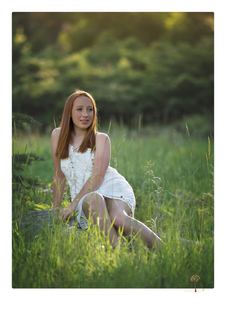Sonora Graduation Photographer Christine Dibble Photography takes portraits of a red headed eighth grade graduate at her eighth grade graduation portrait session outside of Long Barn in fields of flowers.