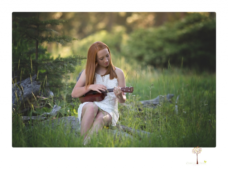 Sonora Graduation Photographer Christine Dibble Photography takes portraits of a red headed eighth grade graduate at her eighth grade graduation portrait session outside of Long Barn in fields of flowers.