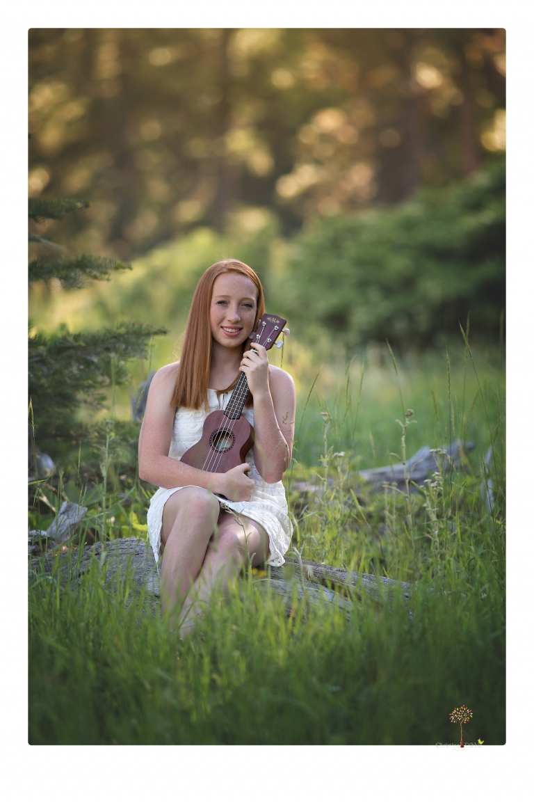 Sonora Graduation Photographer Christine Dibble Photography takes portraits of a red headed eighth grade graduate at her eighth grade graduation portrait session outside of Long Barn in fields of flowers.