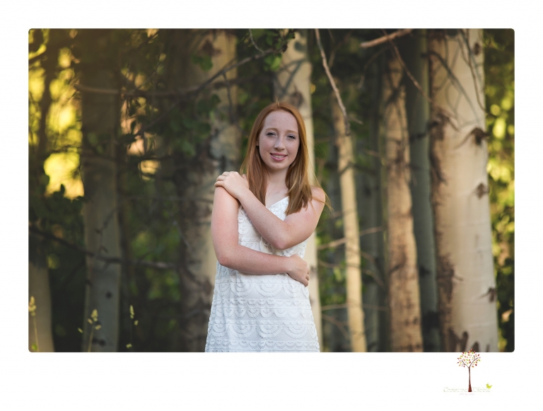 Sonora Graduation Photographer Christine Dibble Photography takes portraits of a red headed eighth grade graduate at her eighth grade graduation portrait session outside of Long Barn in fields of flowers.