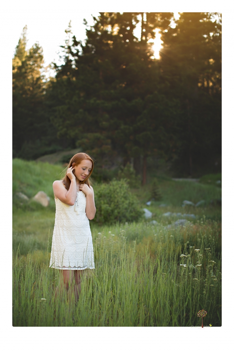 Sonora Graduation Photographer Christine Dibble Photography takes portraits of a red headed eighth grade graduate at her eighth grade graduation portrait session outside of Long Barn in fields of flowers.