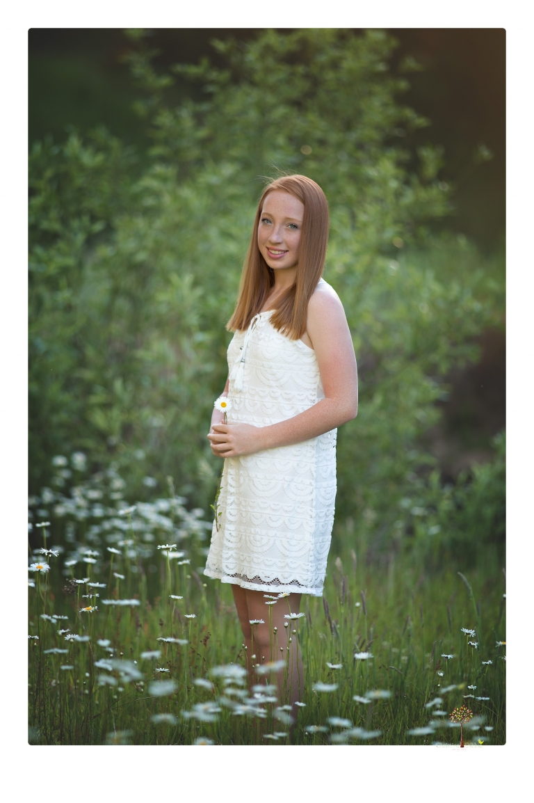 Sonora Graduation Photographer Christine Dibble Photography takes portraits of a red headed eighth grade graduate at her eighth grade graduation portrait session outside of Long Barn in fields of flowers.