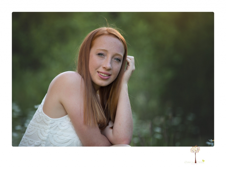 Sonora Graduation Photographer Christine Dibble Photography takes portraits of a red headed eighth grade graduate at her eighth grade graduation portrait session outside of Long Barn in fields of flowers.