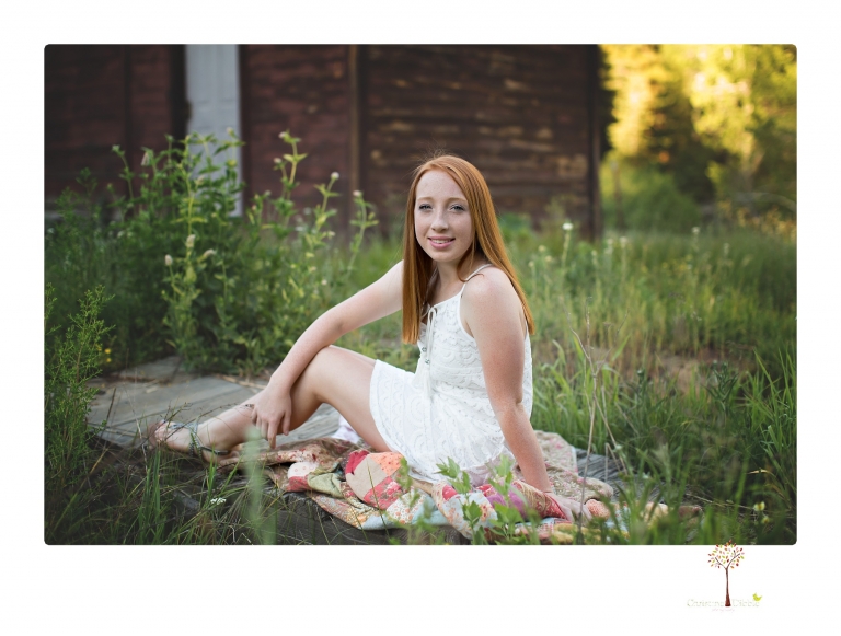 Sonora Graduation Photographer Christine Dibble Photography takes portraits of a red headed eighth grade graduate at her eighth grade graduation portrait session outside of Long Barn in fields of flowers.