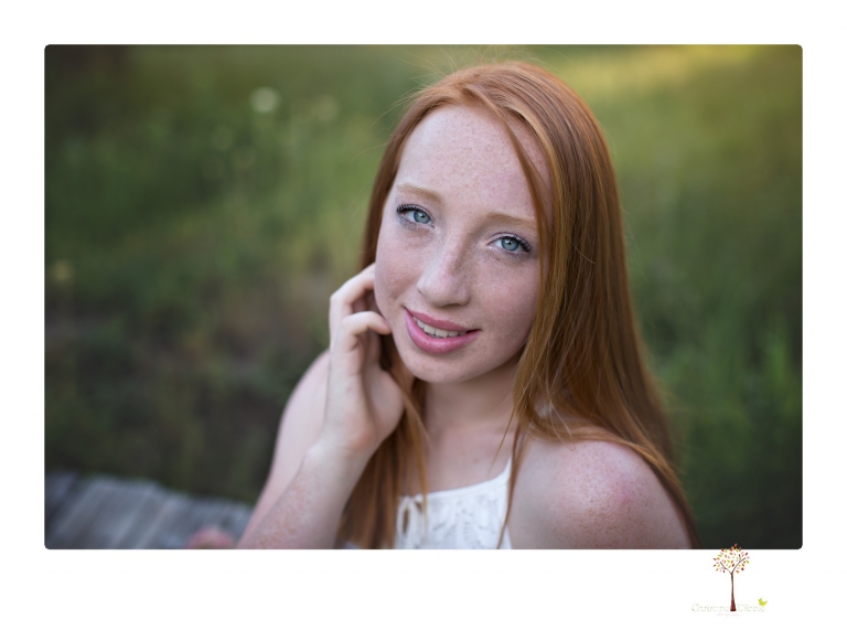 Sonora Graduation Photographer Christine Dibble Photography takes portraits of a red headed eighth grade graduate at her eighth grade graduation portrait session outside of Long Barn in fields of flowers.