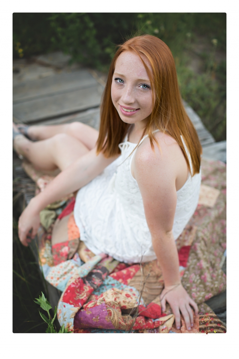 Sonora Graduation Photographer Christine Dibble Photography takes portraits of a red headed eighth grade graduate at her eighth grade graduation portrait session outside of Long Barn in fields of flowers.