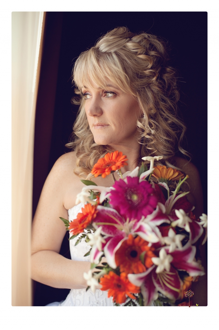 Sonora Wedding Photographer Christine Dibble Photography takes photos of the bride at a Black Oak Casino Resort Hotel wedding.
