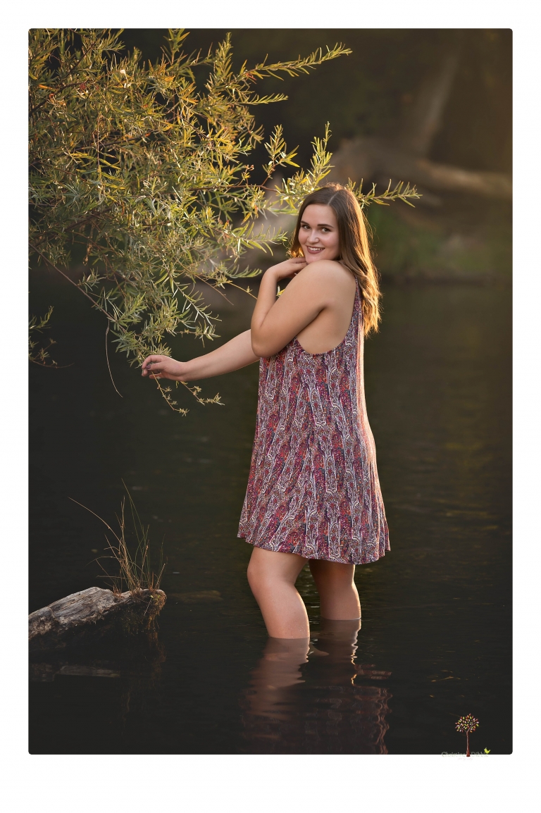 Sonora senior portrait photographer Christine Dibble Photography takes senior portraits of an Orestimba High School student at Knights Ferry in the river.