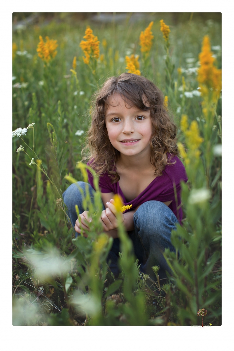 Sonora maternity photographer Christine Dibble Photography takes family maternity portraits of a mom expecting twins  in a wildflower field near Long Barn.