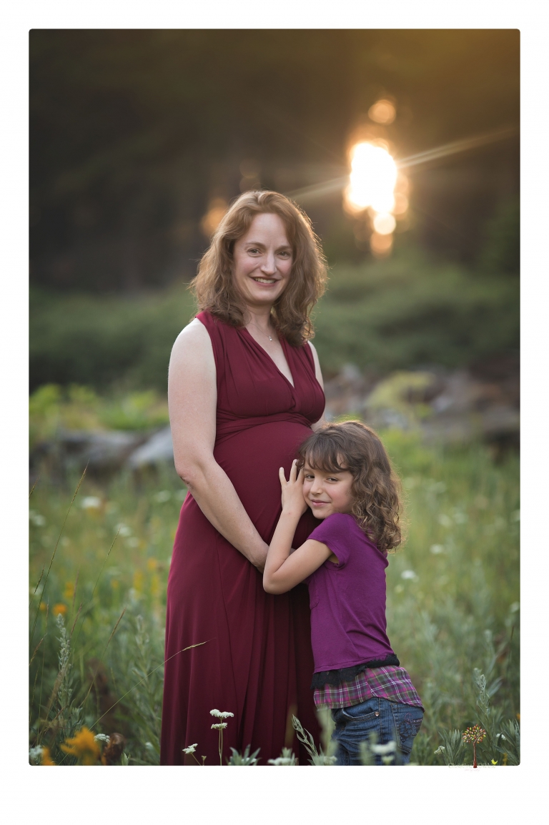 Sonora maternity photographer Christine Dibble Photography takes family maternity portraits of a mom expecting twins  in a wildflower field near Long Barn.