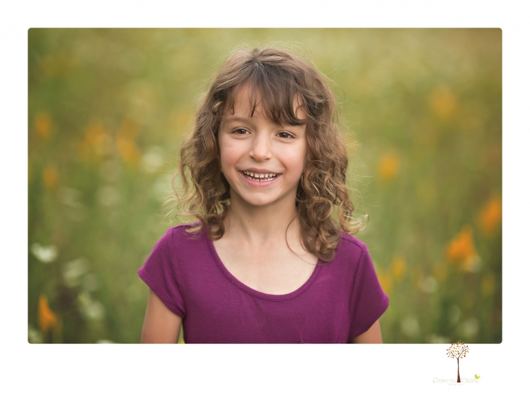 Sonora maternity photographer Christine Dibble Photography takes family maternity portraits of a mom expecting twins  in a wildflower field near Long Barn.