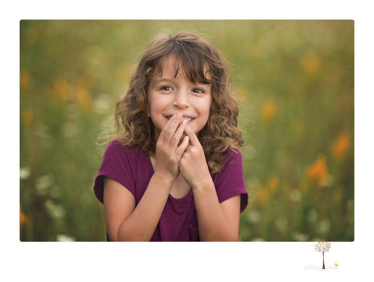 Sonora maternity photographer Christine Dibble Photography takes family maternity portraits of a mom expecting twins  in a wildflower field near Long Barn.
