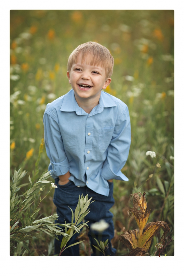 Sonora maternity photographer Christine Dibble Photography takes family maternity portraits of a mom expecting twins  in a wildflower field near Long Barn.
