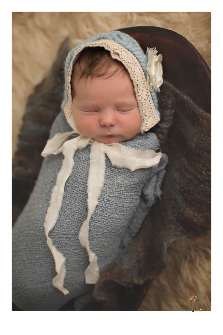 Sonora Newborn Photographer Christine Dibble Photography takes newborn studio portraits of babies and their parents and families with various vintage props.