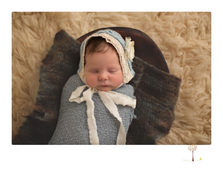 Sonora Newborn Photographer Christine Dibble Photography takes newborn studio portraits of babies and their parents and families with various vintage props.