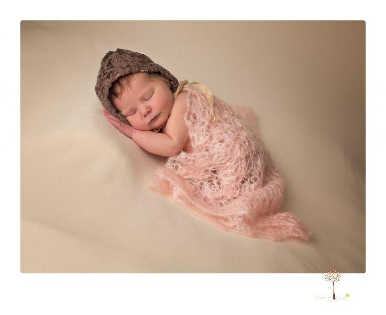 Sonora Newborn Photographer Christine Dibble Photography takes newborn studio portraits of babies and their parents and families with various vintage props.