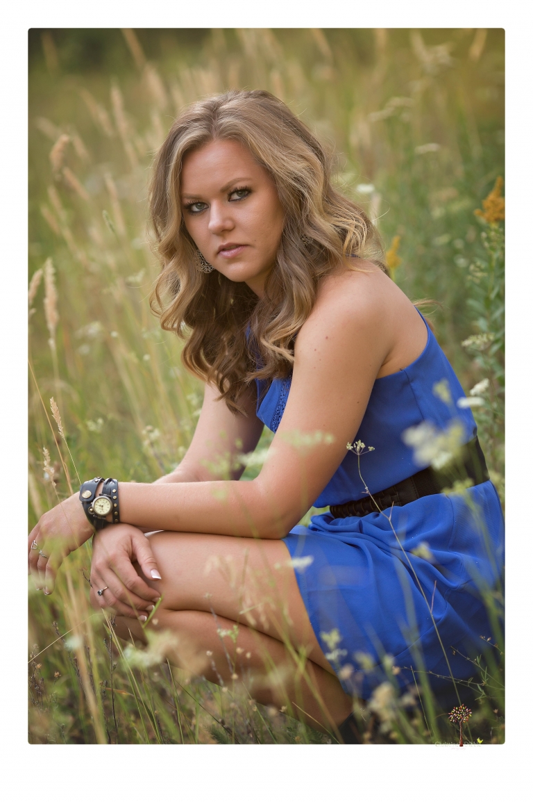Summerville High senior portrait photographer Christine Dibble Photography of Sonora takes senior portraits of a girl in a field of wildflowers with her violin.