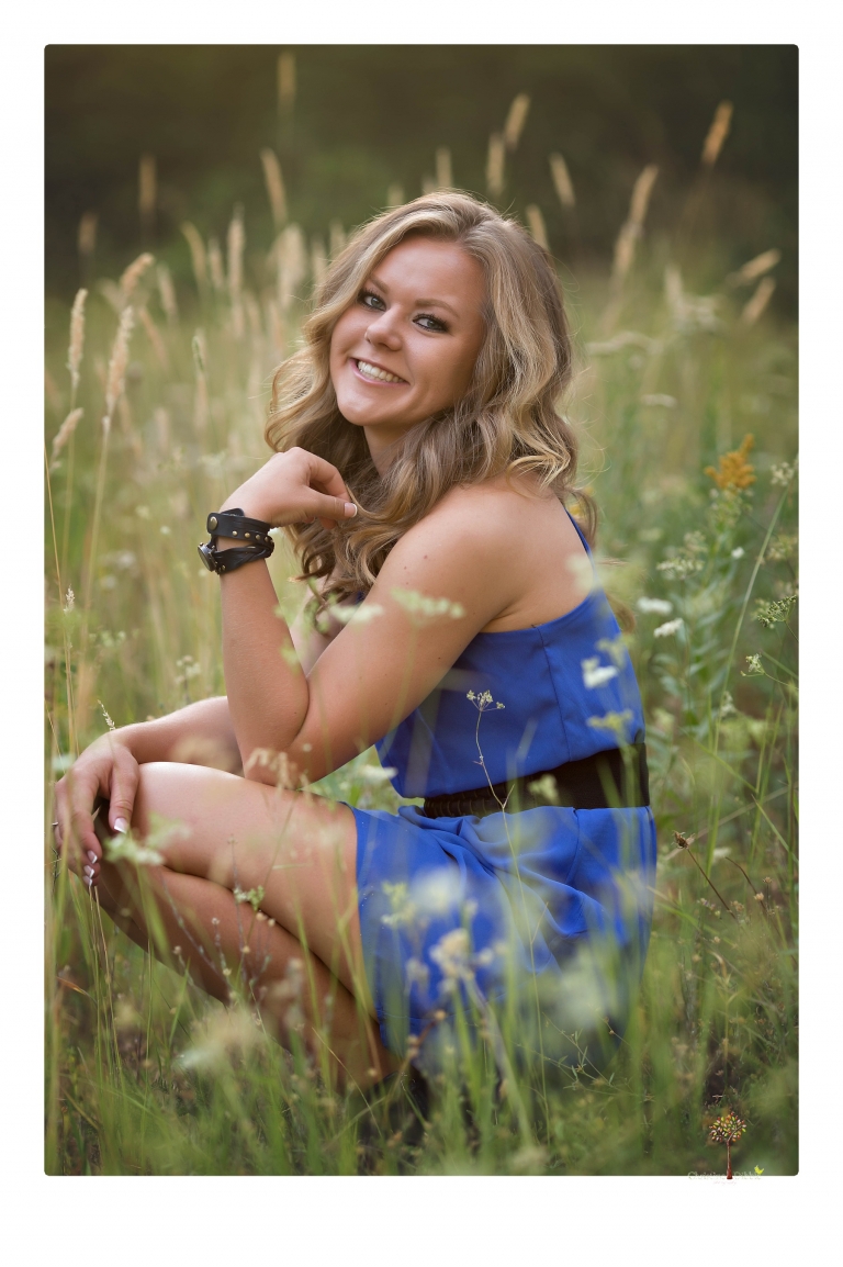 Summerville High senior portrait photographer Christine Dibble Photography of Sonora takes senior portraits of a girl in a field of wildflowers with her violin.