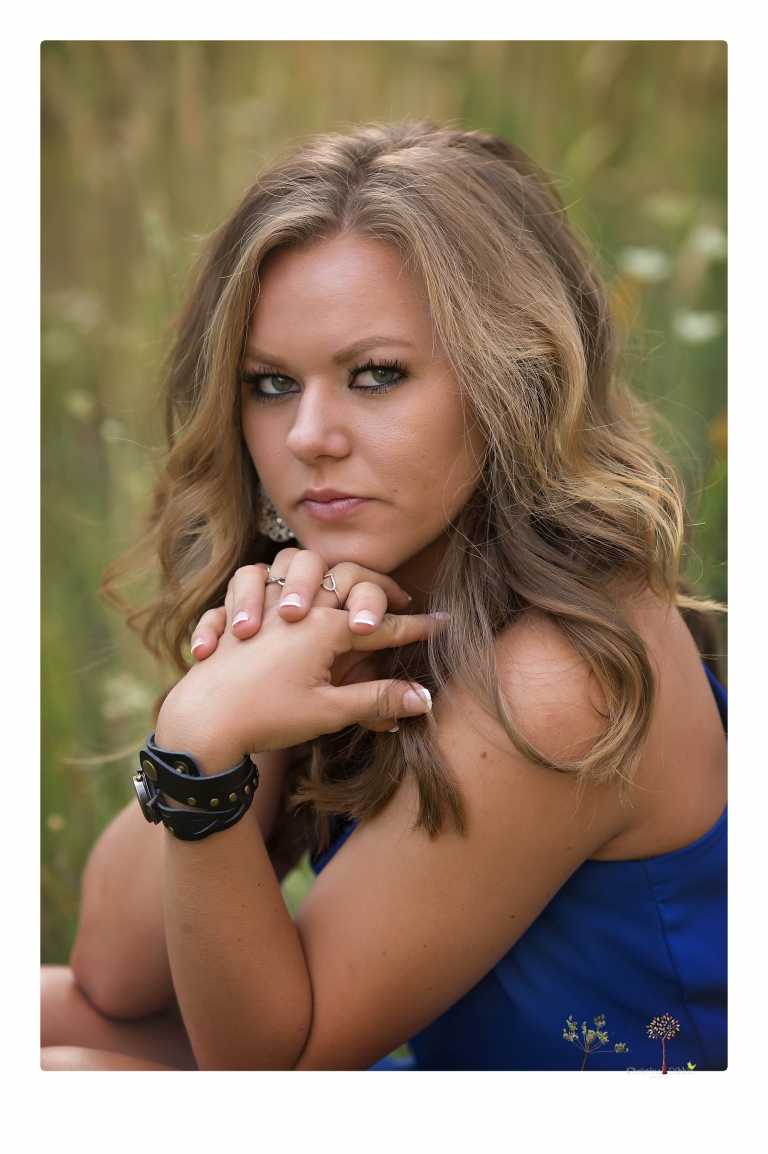 Summerville High senior portrait photographer Christine Dibble Photography of Sonora takes senior portraits of a girl in a field of wildflowers with her violin.