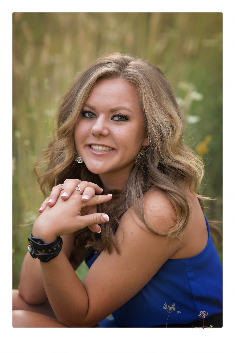 Summerville High senior portrait photographer Christine Dibble Photography of Sonora takes senior portraits of a girl in a field of wildflowers with her violin.