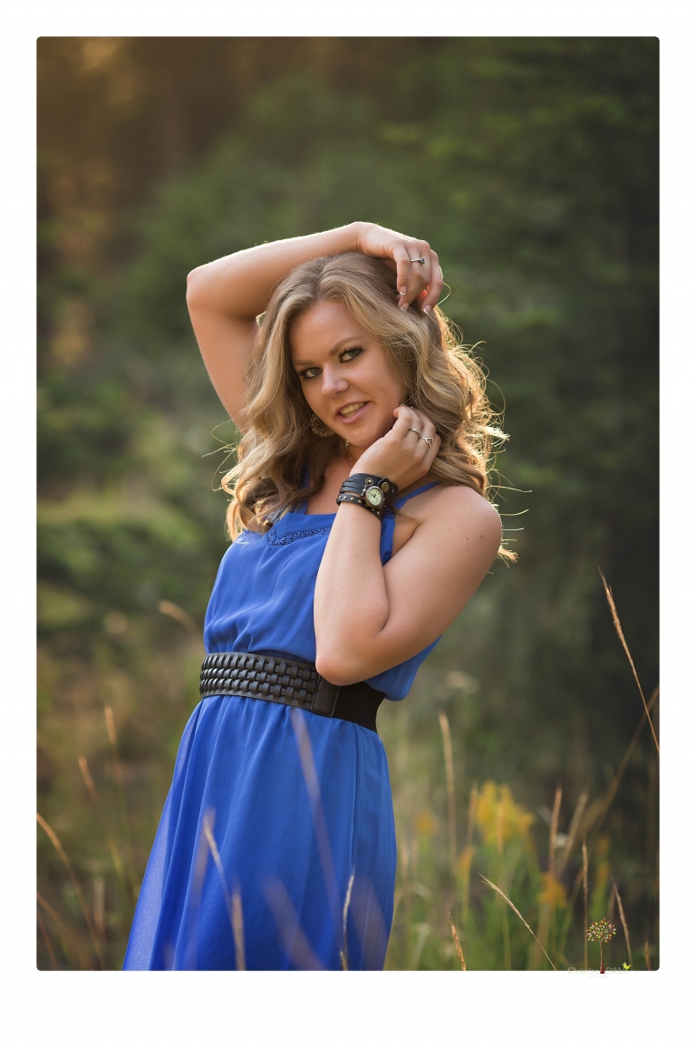 Summerville High senior portrait photographer Christine Dibble Photography of Sonora takes senior portraits of a girl in a field of wildflowers with her violin.