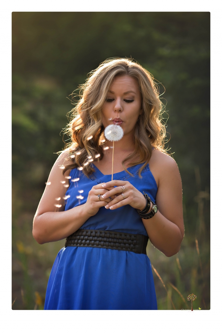 Summerville High senior portrait photographer Christine Dibble Photography of Sonora takes senior portraits of a girl in a field of wildflowers with her violin.