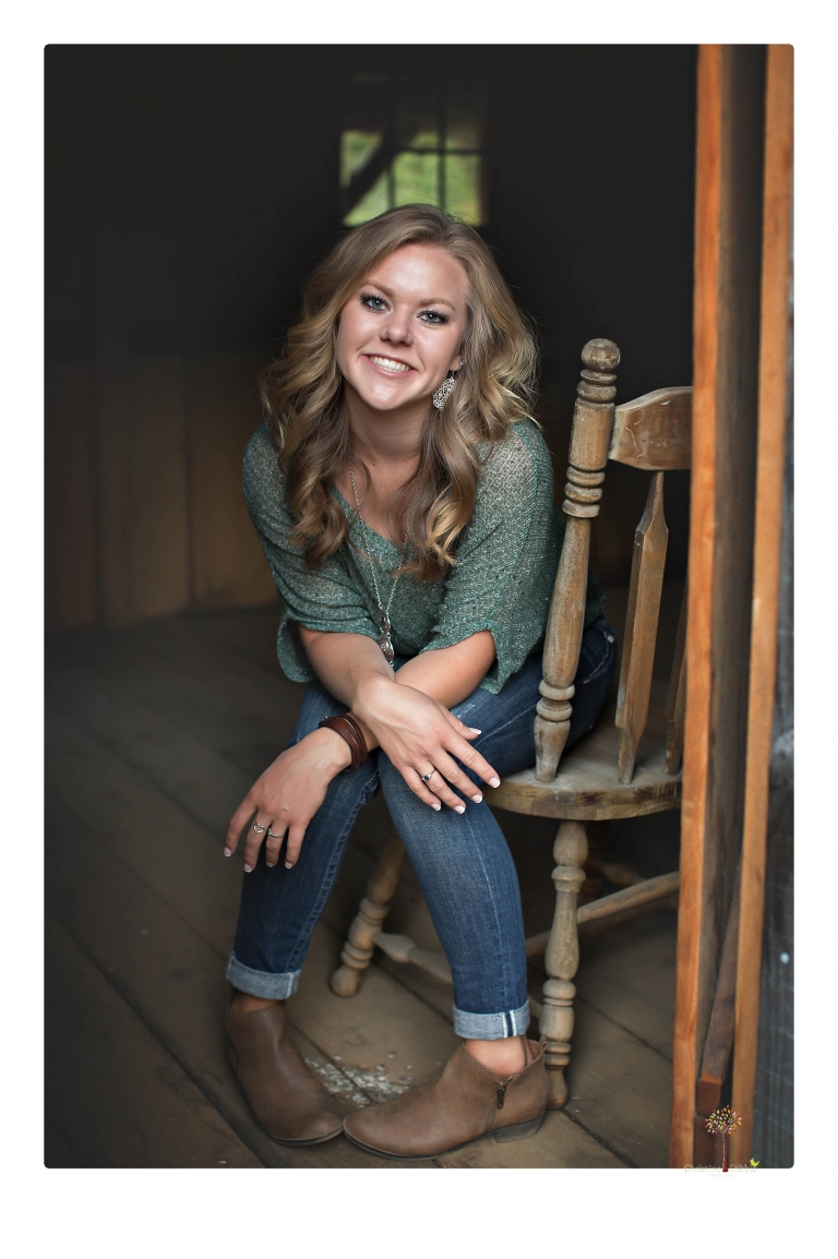 Summerville High senior portrait photographer Christine Dibble Photography of Sonora takes senior portraits of a girl in a field of wildflowers with her violin.