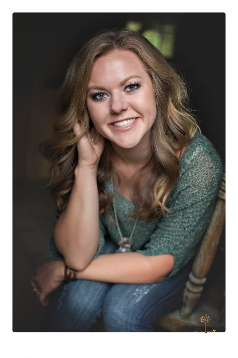 Summerville High senior portrait photographer Christine Dibble Photography of Sonora takes senior portraits of a girl in a field of wildflowers with her violin.