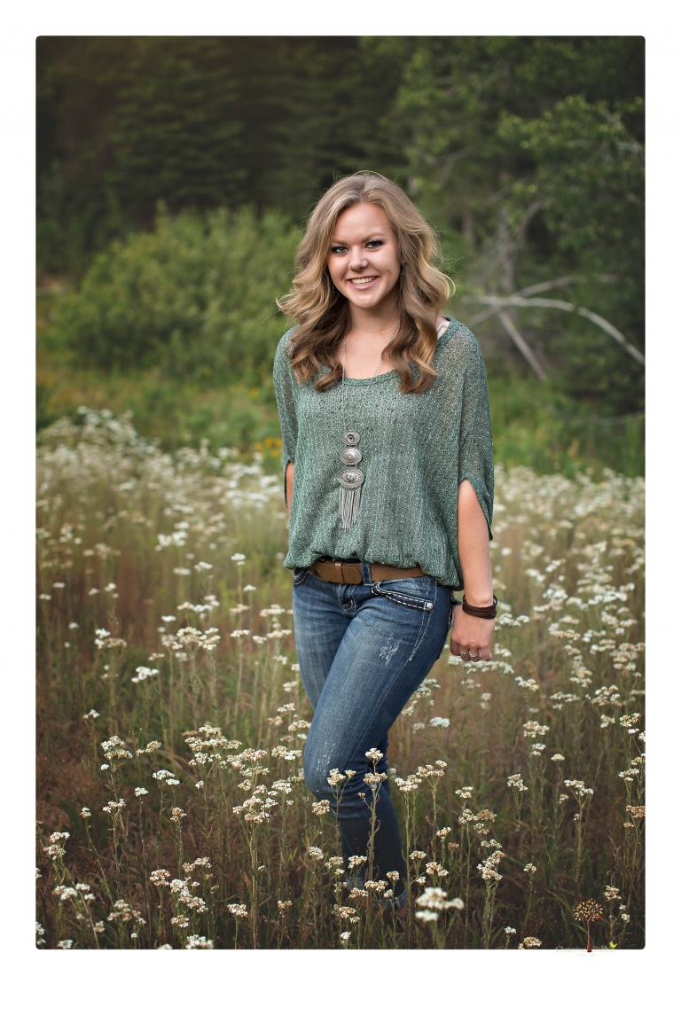 Summerville High senior portrait photographer Christine Dibble Photography of Sonora takes senior portraits of a girl in a field of wildflowers with her violin.